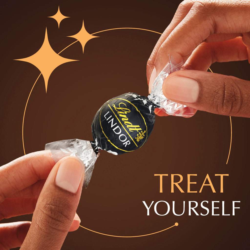 Lindt LINDOR Holiday Snickerdoodle White Chocolate Candy Truffles with Smooth, Melting Truffle Center, 8.5 oz. Bag
