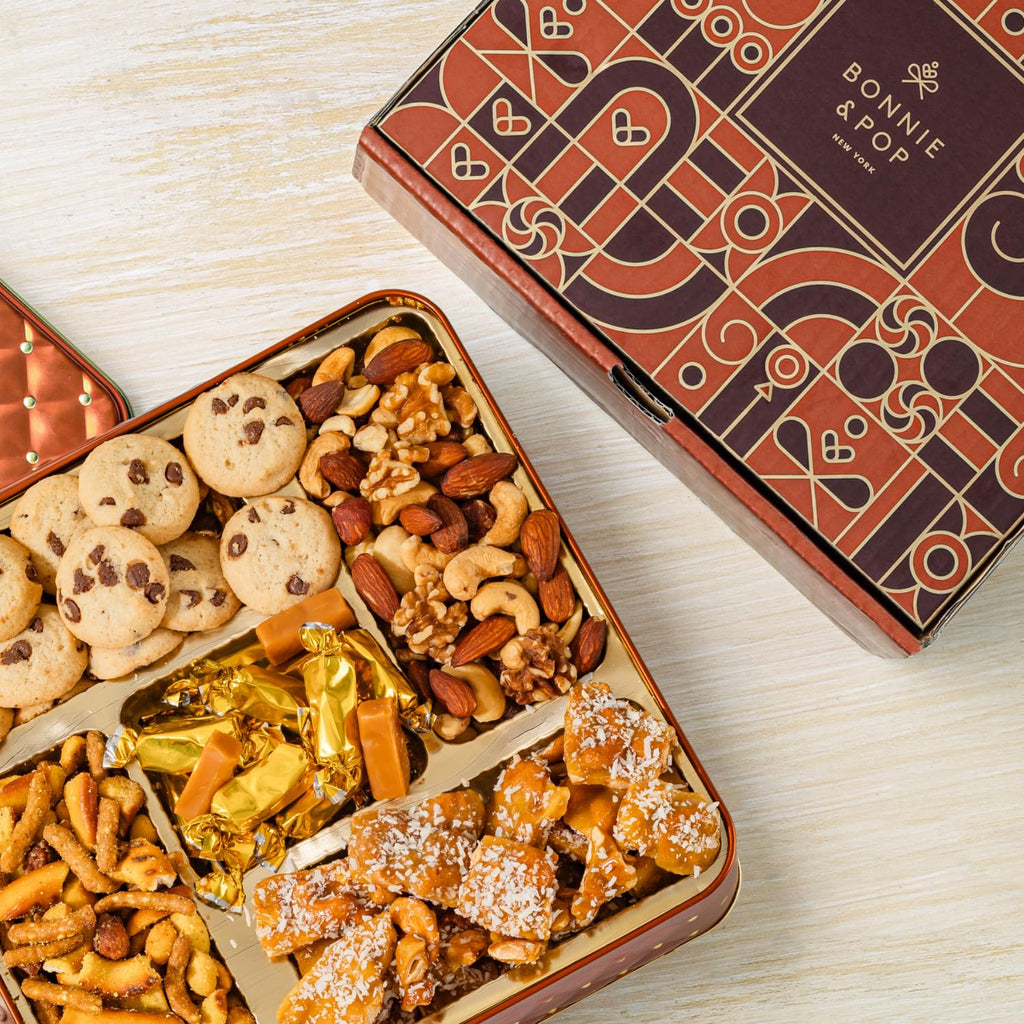 Caramels and Nut Sweet and Savory Gift Basket for Christmas Gifts, Dad, Men, Women, Holiday Parties | Gourmet Holiday Snack Tin Box | Churro Cinnamon and Sugar Pretzels | Sea Salt Caramels and Brittle| Prime Delivery Gift | Bonnie & Pop