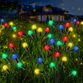 Rossesay 4 Pcs St Patricks Day Outdoor Decorations Solar Lights Waterproof Green 48 LED Swaying Pathway Firefly Stake Lights for Outside Yard Garden Lawn Decorations(Green White,Pine Cone)