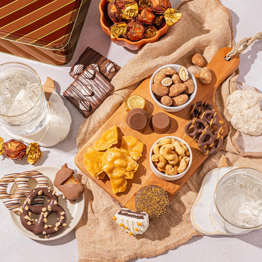 Caramels and Nut Sweet and Savory Gift Basket for Christmas Gifts, Dad, Men, Women, Holiday Parties | Gourmet Holiday Snack Tin Box | Churro Cinnamon and Sugar Pretzels | Sea Salt Caramels and Brittle| Prime Delivery Gift | Bonnie & Pop