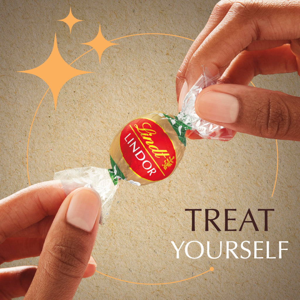 Lindt LINDOR Holiday Snickerdoodle White Chocolate Candy Truffles with Smooth, Melting Truffle Center, 8.5 oz. Bag