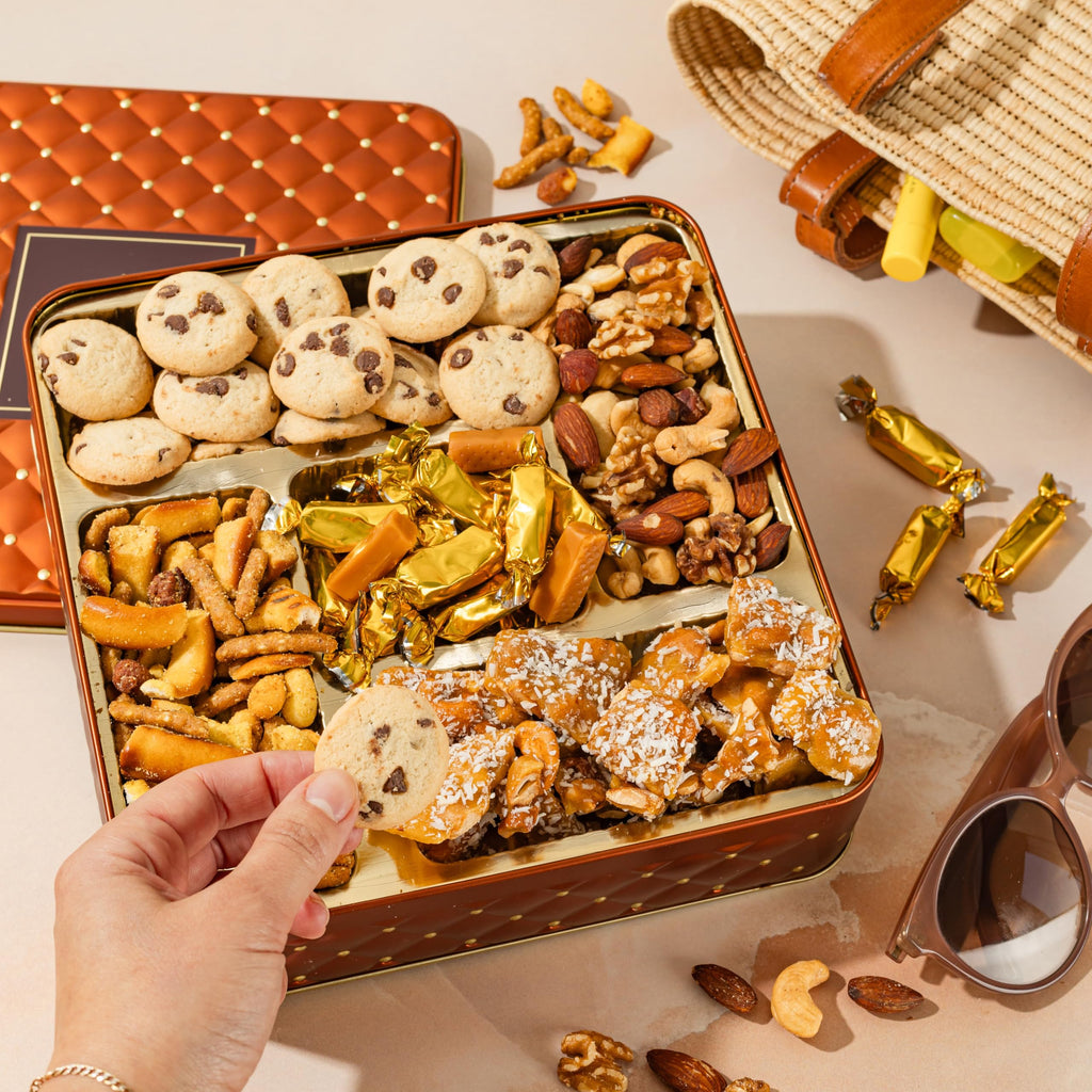 Caramels and Nut Sweet and Savory Gift Basket for Christmas Gifts, Dad, Men, Women, Holiday Parties | Gourmet Holiday Snack Tin Box | Churro Cinnamon and Sugar Pretzels | Sea Salt Caramels and Brittle| Prime Delivery Gift | Bonnie & Pop
