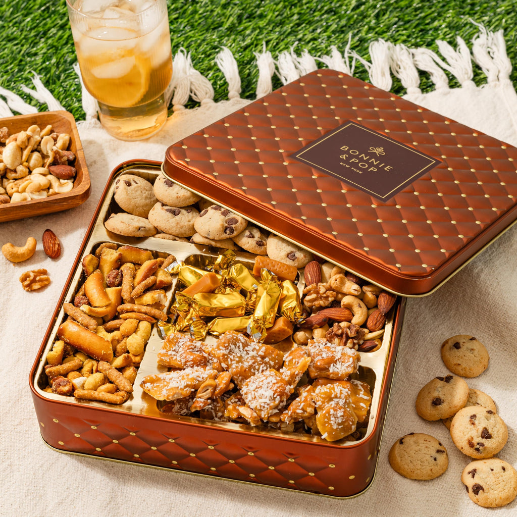 Caramels and Nut Sweet and Savory Gift Basket for Christmas Gifts, Dad, Men, Women, Holiday Parties | Gourmet Holiday Snack Tin Box | Churro Cinnamon and Sugar Pretzels | Sea Salt Caramels and Brittle| Prime Delivery Gift | Bonnie & Pop